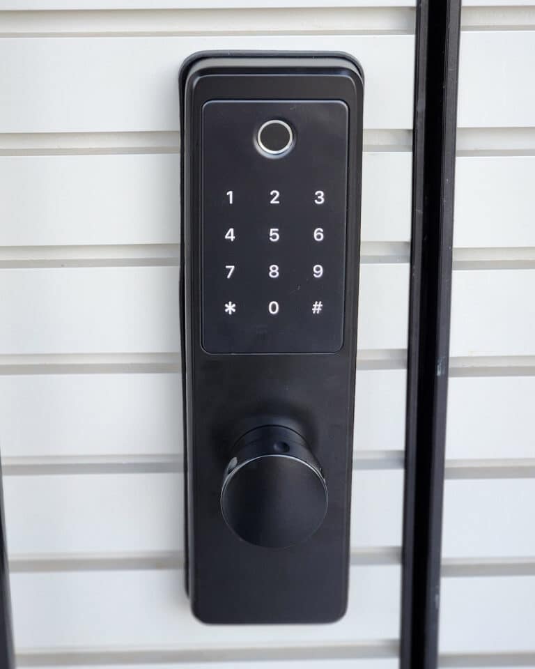 Elock Wize finish black installed by smart lock israel. A decorated white door. (2)